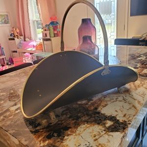 Brass firewood log holder with claw feet and handle